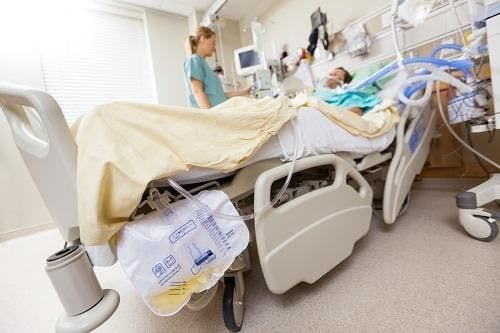 person lying in hospital bed