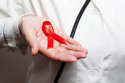 Doctor with HIV ribbon in his hand