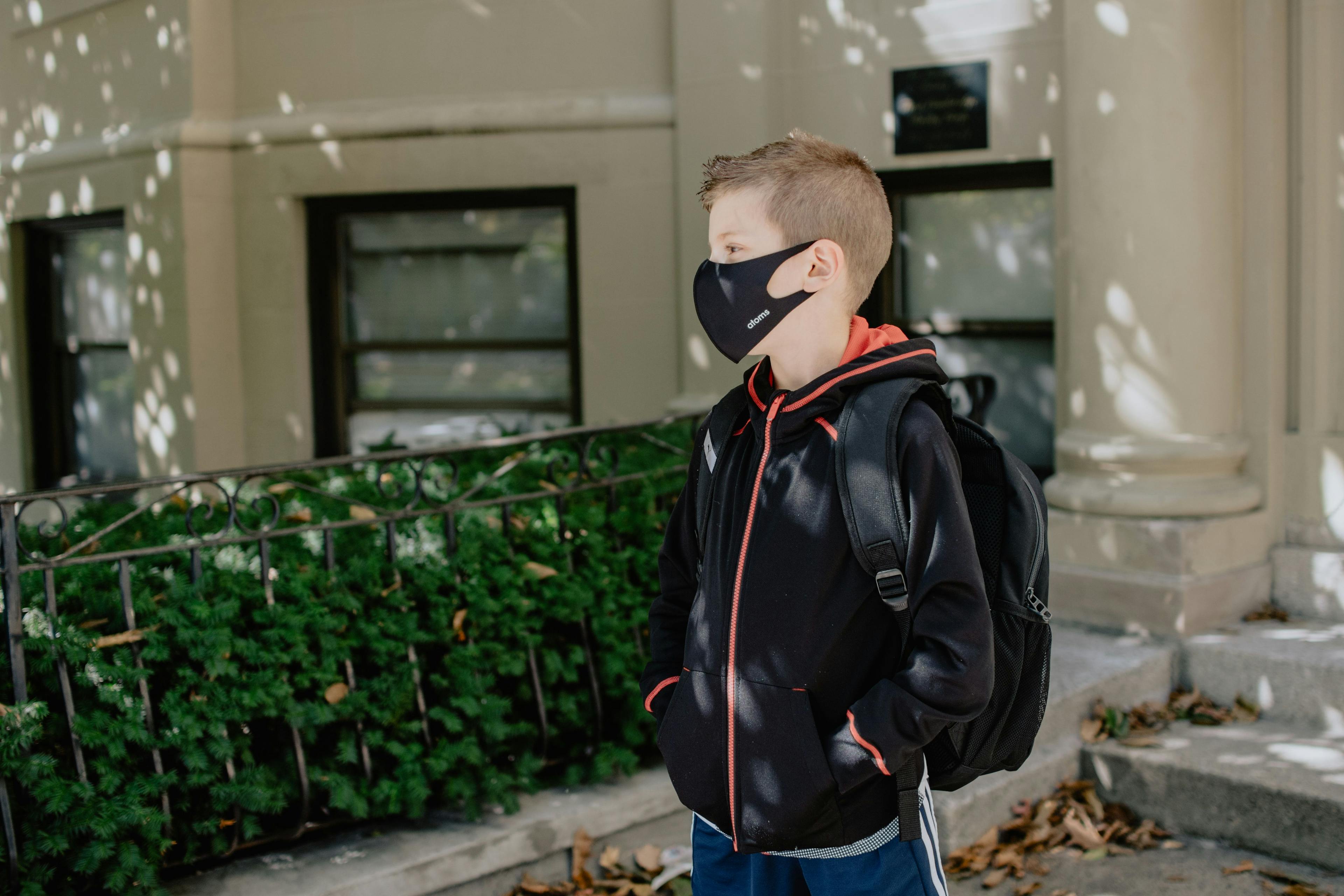 the benefits to children of wearing face masks to prevent COVID-19 outweigh potential infectious risks from face touching, according to a study analyzing hand-to-face contacts in a simulated school environment.
