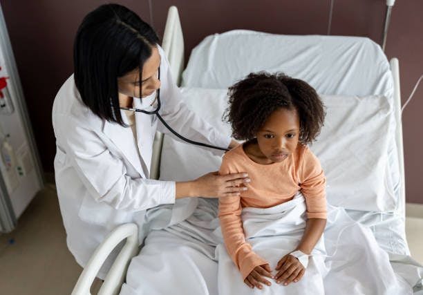 Doctor checking on child in hospital | Image credits: Unsplash